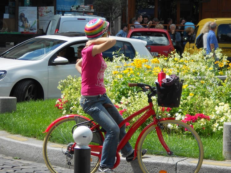 Girl on a red bike